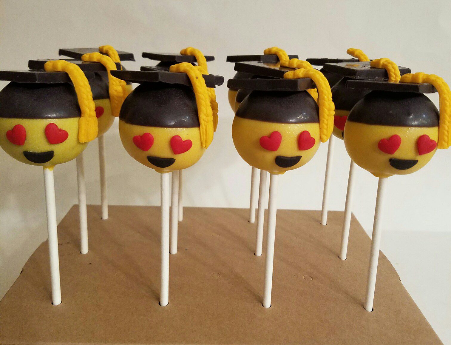 Graduation cakes emoji cake pops